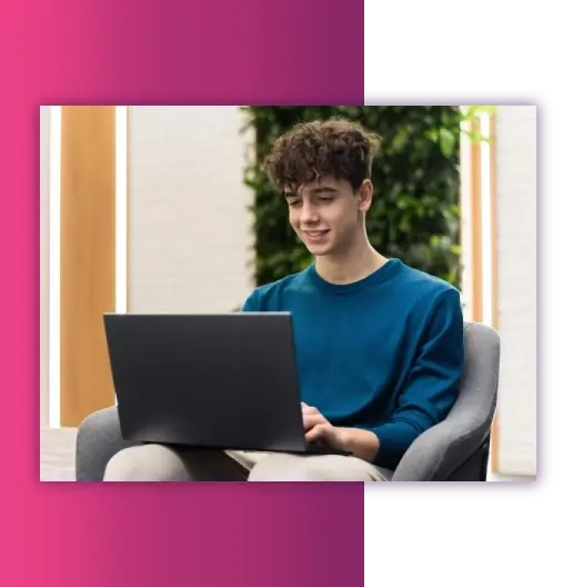 University student using a laptop to review management assignment requirements